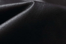 Load image into Gallery viewer, Close-up of the luxurious leather texture of the REED Men&#39;s Premium Leather Aviator Bomber Jacket, showcasing its quality craftsmanship.
