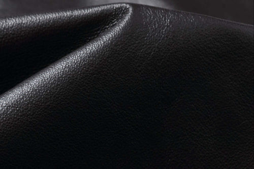 Close-up of the luxurious leather texture of the REED Men's Premium Leather Aviator Bomber Jacket, showcasing its quality craftsmanship.