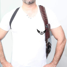 Load image into Gallery viewer, Cowhide Leather Vertical Concealed Holster Right Handers Universal Size worn on a model showcasing the brown leather and magazine pouch.
