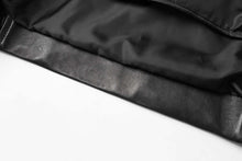 Load image into Gallery viewer, Black interior lining of REED Men&#39;s New Zealand Lambskin Leather Jacket showing fine craftsmanship and soft texture.
