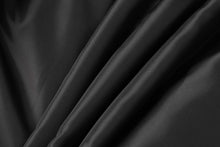 Load image into Gallery viewer, Close-up of smooth black lambskin leather fabric, illustrating texture for REED Men&#39;s Leather Jacket.
