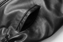 Load image into Gallery viewer, Close-up of black New Zealand lambskin leather jacket pocket from REED, featuring smooth, soft-touch finish and crafted design.
