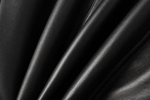 Load image into Gallery viewer, Close-up of smooth black lambskin leather texture, showcasing the soft finish and high-quality material of a leather jacket.
