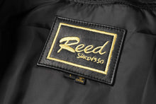 Load image into Gallery viewer, Reed Est. 1950 label on genuine lambskin leather jacket for men, highlighting premium quality and timeless style.
