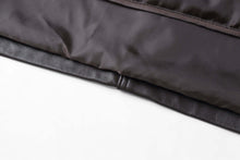 Load image into Gallery viewer, Close-up of REED men&#39;s jacket featuring genuine lambskin leather with lining and seam detail.
