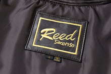 Load image into Gallery viewer, REED jacket label showing &quot;Reed Since 1950&quot; embroidery on black lambskin leather coat.
