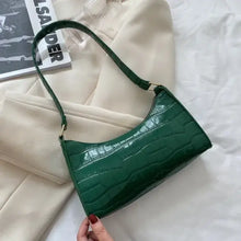 Cargar imagen en el visor de la galería, Green vegan leather shoulder bag on white fabric backdrop
