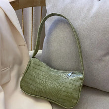 Load image into Gallery viewer, Green crocodile pattern PU leather women&#39;s shoulder bag on beige sofa, perfect for stylish travel and versatile occasions.
