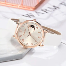 Cargar imagen en el visor de la galería, Elegant moon bracelet watch with celestial dial on white strap, ideal for modern women&#39;s style and sophistication.
