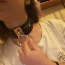 Load image into Gallery viewer, Person wearing leather choker bandage collar with metal ring, showcasing fashionable edgy style.
