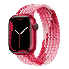 Load image into Gallery viewer, Pink braided nylon strap for Apple Watch, compatible with 38mm to 45mm models, shown on a red Apple Watch.
