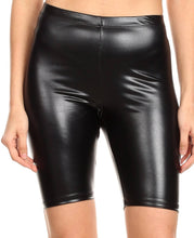 Charger l&#39;image dans la galerie, Shiny black metallic bike shorts, stretchy unisex design, modeled on person, made in USA.
