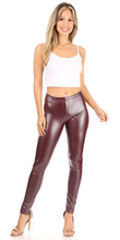Load image into Gallery viewer, Model wearing matte liquid high waist stretch leggings in burgundy, paired with a white tank top, showcasing the sleek and stylish fit.

