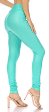 Load image into Gallery viewer, Model wearing matte liquid high waist stretch leggings in turquoise, side view showing fit and length. Made in USA.
