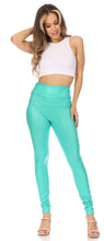 Load image into Gallery viewer, Model wearing teal matte high waist stretch leggings with white cropped tank top, showcasing sleek design and comfort fit.
