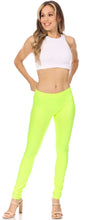 Load image into Gallery viewer, Woman wearing neon yellow high waist stretch leggings, styled with a white crop top and heels for a trendy casual look.
