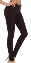 Charger l&#39;image dans la galerie, Woman wearing black footless stretch leggings, made in USA, showcasing a slim fit ideal for yoga or casual wear.
