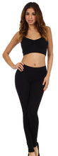 Charger l&#39;image dans la galerie, Woman wearing black cotton blend footless leggings, ideal for yoga or casual wear, designed for comfort and style.
