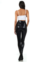 Charger l&#39;image dans la galerie, Woman wearing shiny black high waist metallic leggings with a white top, showcasing back view. Perfect fit, made in USA.
