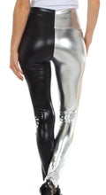 Charger l&#39;image dans la galerie, Person wearing shiny liquid metallic high waist stretch leggings in black and silver, side view, made in USA.
