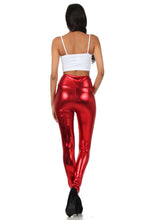 Charger l&#39;image dans la galerie, Model wearing shiny red liquid metallic high waist stretch leggings, back view. Made in USA fashion leggings, perfect for bold style.

