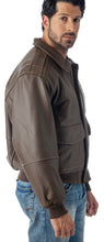 Cargar imagen en el visor de la galería, Man wearing a brown leather jacket and blue jeans on a white background

