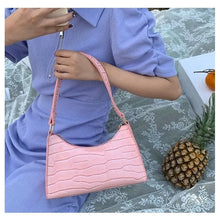 Load image into Gallery viewer, Pink crocodile pattern PU leather shoulder bag for women, perfect for any occasion, displayed with fruit on a lace surface.
