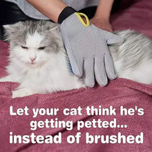 Load image into Gallery viewer, Cat enjoying a grooming session with Amazing Grooming Gloves on a pink blanket.
