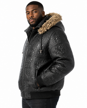 Cargar imagen en el visor de la galería, Man wearing Original Detroit High Roller Jacket by REED with unique embossed design and fur collar, showcasing style and luxury.
