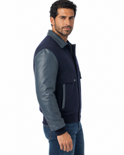 Load image into Gallery viewer, Man wearing REED leather varsity bomber jacket with wool body and leather sleeves, made in USA, classic and stylish design.
