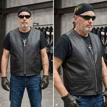 Load image into Gallery viewer, Man wearing a black leather vest with motorcycle gear in the background

