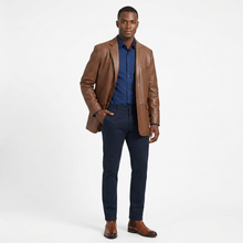 Load image into Gallery viewer, Man wearing a brown leather jacket, blue shirt, and dark pants on a white background
