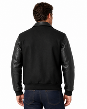 Load image into Gallery viewer, Man wearing REED leather varsity bomber jacket with wool body and leather sleeves, made in USA, classic and stylish design.
