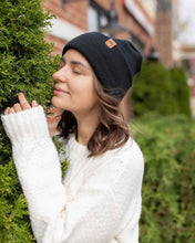 Charger l&#39;image dans la galerie, Woman wearing NEW HAAKWEAR H-Stitch Cuffed Beanie - Designed and Made in USA (Patented Design) - Charcoal Black outdoors.
