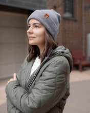 Load image into Gallery viewer, Woman wearing NEW HAAKWEAR H-Stitch Cuffed Beanie - Designed and Made in USA (Patent Pending Design) - Koala Gray outdoors
