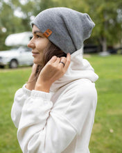 Load image into Gallery viewer, Person wearing NEW HAAKWEAR H-Stitch Cuffed Beanie - Designed and Made in USA (Patent Pending Design) - Koala Gray outdoors.
