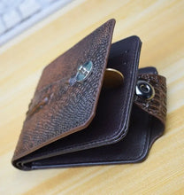 Load image into Gallery viewer, Vintage style genuine leather men&#39;s wallet with crocodile pattern, open to show interior card slots and coin pocket, on wood surface.

