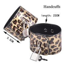 Cargar imagen en el visor de la galería, Leopard print leather handcuffs with lock and key, measuring 23cm in length. Part of a BDSM bondage set for adults.
