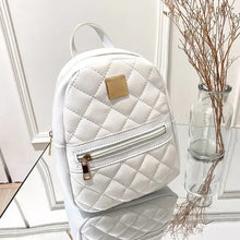 Load image into Gallery viewer, White quilted mini backpack for women, PU leather, multifunctional crossbody bag on glass surface next to decorative branches.
