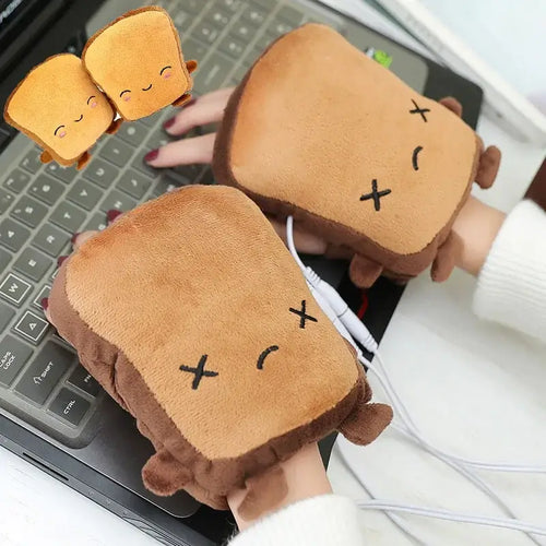 Cozy toast-shaped hand warmers plugged into a laptop, designed to keep hands warm and comfortable in cold weather.