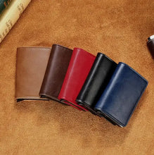 Load image into Gallery viewer, Assorted Hold Anti-Theft Leather Wallets with RFID/NFC Protection in brown, red, black, and blue on a leather background.

