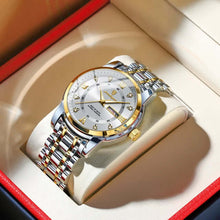 Cargar imagen en el visor de la galería, Luxury men&#39;s watch with gold and silver design, elegant timepiece in a display box, symbolizing sophistication and success.
