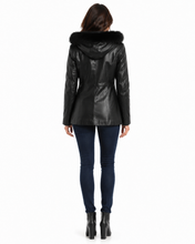 Load image into Gallery viewer, Person wearing a black leather jacket with fur hood on a white background

