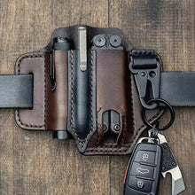 Load image into Gallery viewer, Leather tactical multi-tool belt bag with compartments for tools and key holder, made from durable vegan leather, on wooden surface.
