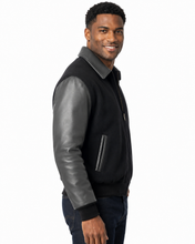 Load image into Gallery viewer, REED Men's Executive Varsity Jacket with cowhide leather sleeves and wool body, union-made in the USA, worn by a model.
