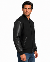 Cargar imagen en el visor de la galería, REED Men's Premium Varsity Black Leather Wool Jacket, stylish and warm, made in USA, featuring quilted lining and inside pocket.
