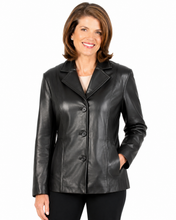 Charger l'image dans la galerie, A woman wearing a black real-leather blazer with a three-button front closure, notched lapels, and side pockets, shown against a plain white background.
