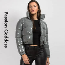 Load image into Gallery viewer, Woman wearing a glossy grey puffer jacket with a high collar and black pants, featuring the phrase &#39;Passion Goddess&#39; on the left.
