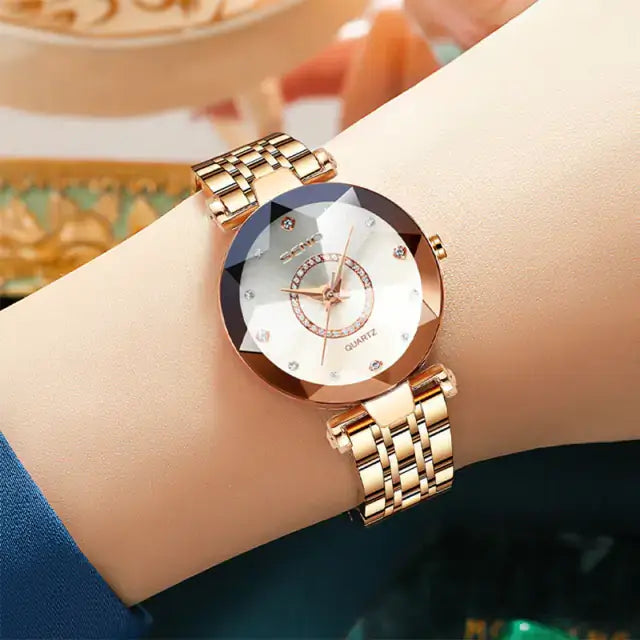 Elegant quartz watch with stainless steel band on wrist, showcasing a sophisticated design perfect for women.