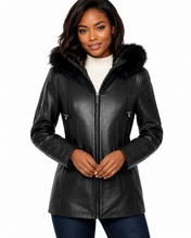 Load image into Gallery viewer, Woman wearing a black leather jacket with fur hood on a white background
